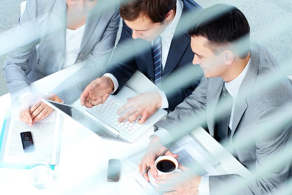 Group of business partners working at meeting in office
